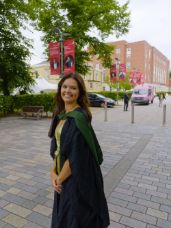 Maddie with a sign growing out of her head.